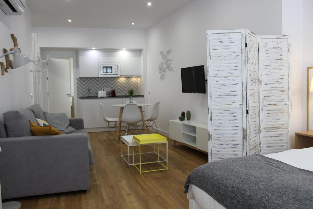 TV a/nebo společenská místnost v ubytování Encanto de la Catedral Ha Loft