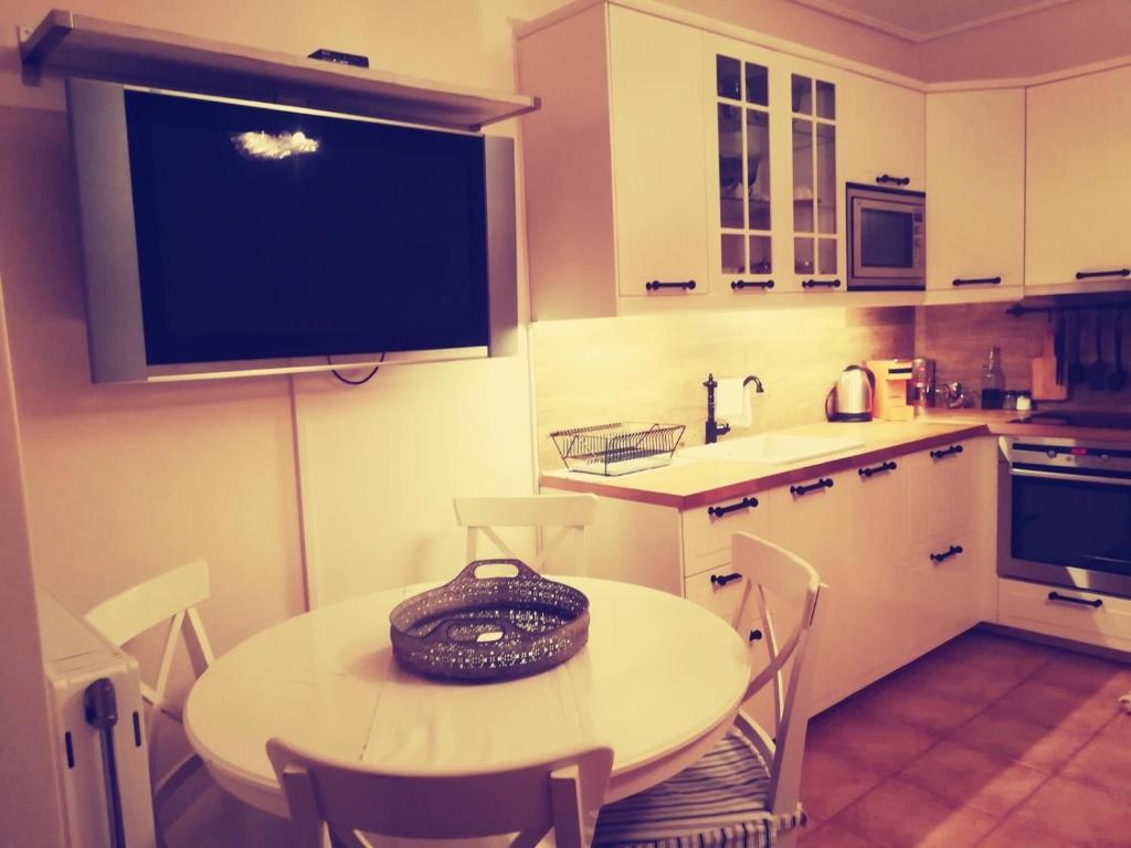 A kitchen or kitchenette at Lux House next to the Airport of Athens. Transport 24h