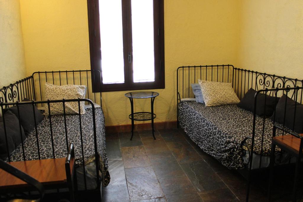 Postel nebo postele na pokoji v ubytování Casas Rurales Las Cuevas El Rincón