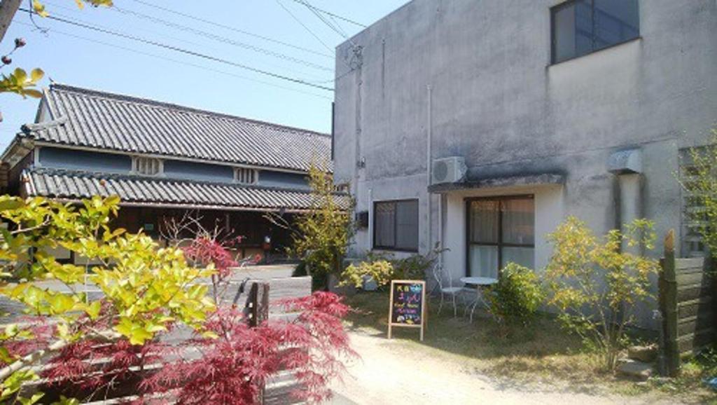 a building with a sign in front of it at Minshuku Marin - Vacation STAY 90965 in Higashikagawa