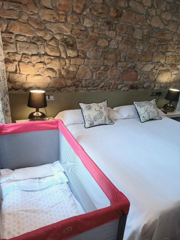 Postel nebo postele na pokoji v ubytování Hotel Eutimio