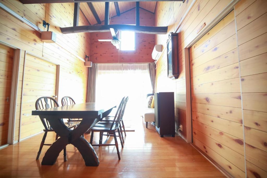 a dining room with a table and chairs at guest house Kuu - Vacation STAY 46399v in Takashima