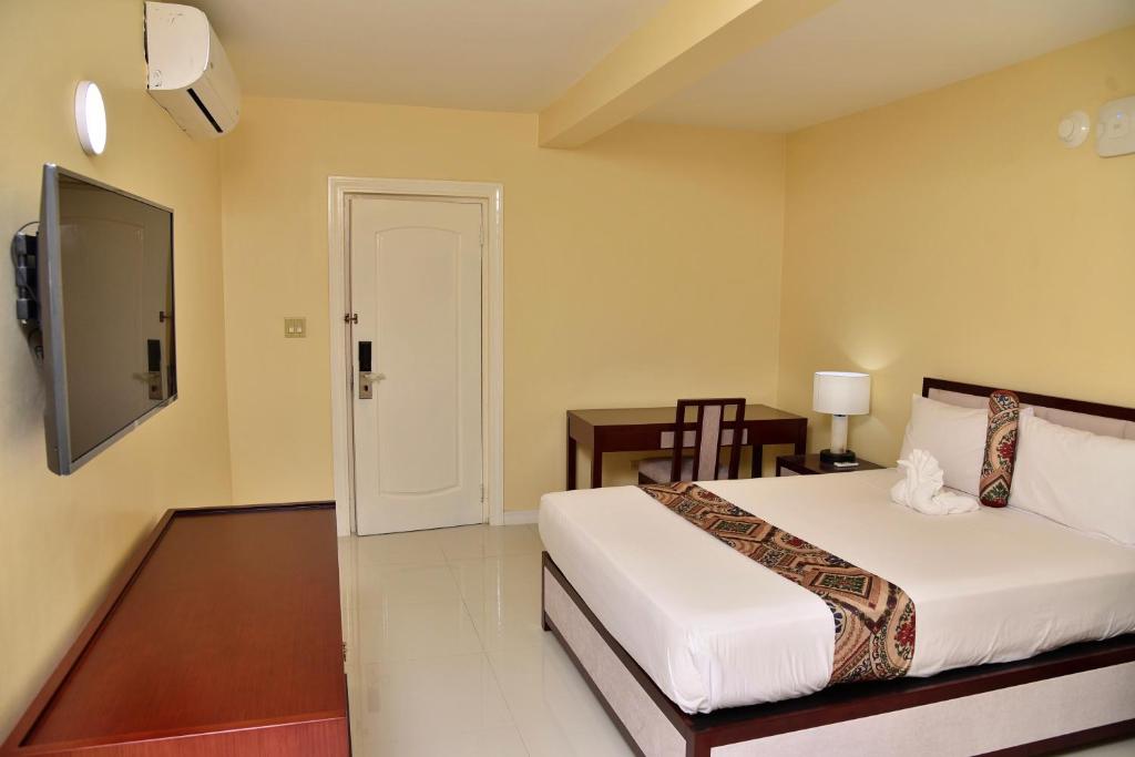 Uma cama ou camas num quarto em Hotel Grand A View