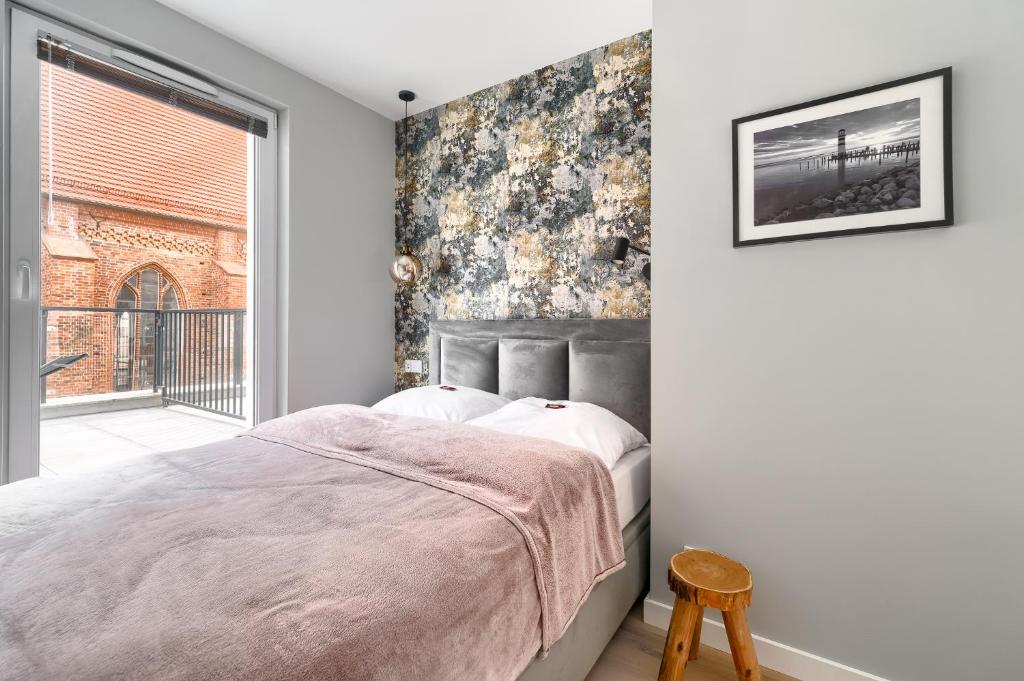 Posteľ alebo postele v izbe v ubytovaní Apartament 1000 Stare Miasto bulwary Apartamenty No 1