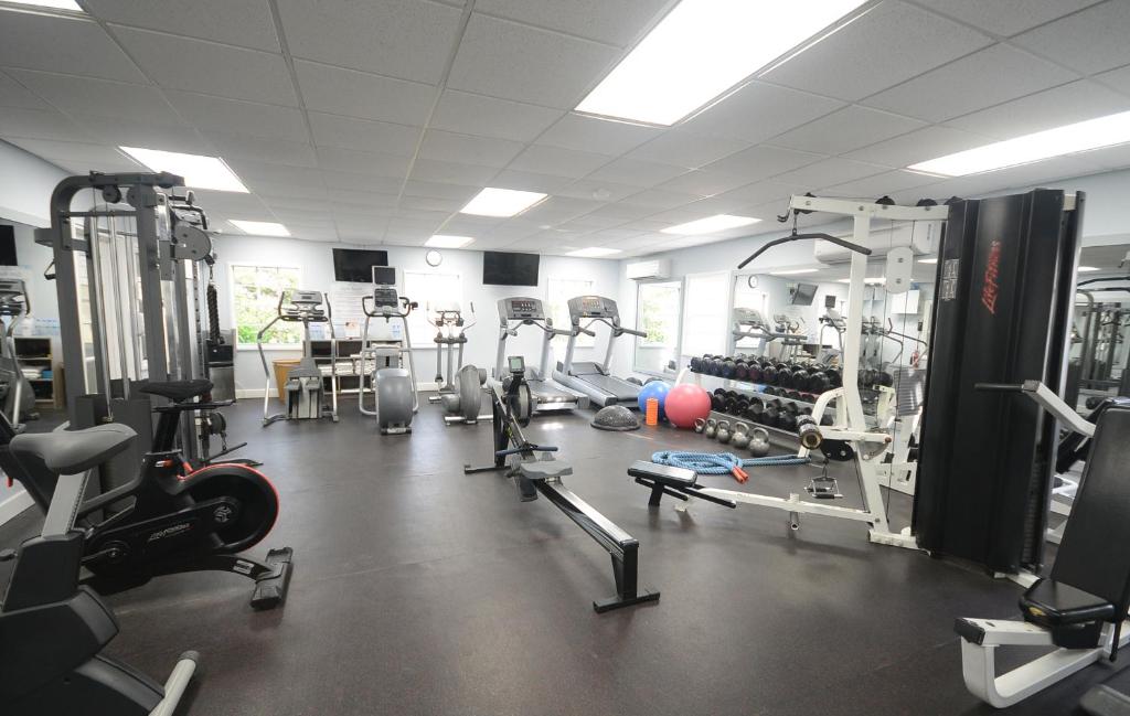 a gym with several treadmills and machines in it at Sugar Bay Barbados - All Inclusive in Bridgetown
