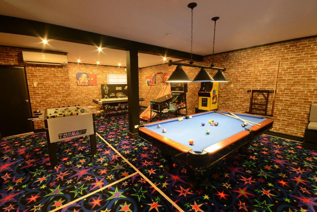 a billiard room with a pool table in the middle at Sugar Bay Barbados - All Inclusive in Bridgetown