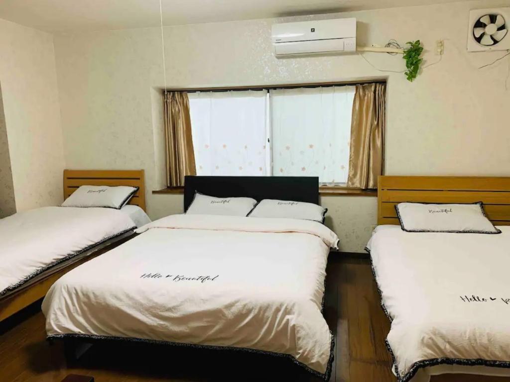Giường trong phòng chung tại Family House - Vacation STAY 53006v
