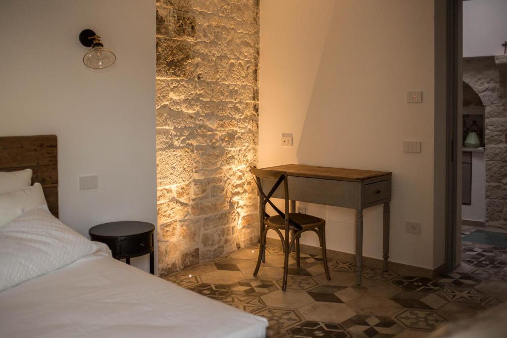 Postel nebo postele na pokoji v ubytování Trullo e Suites Parini 32