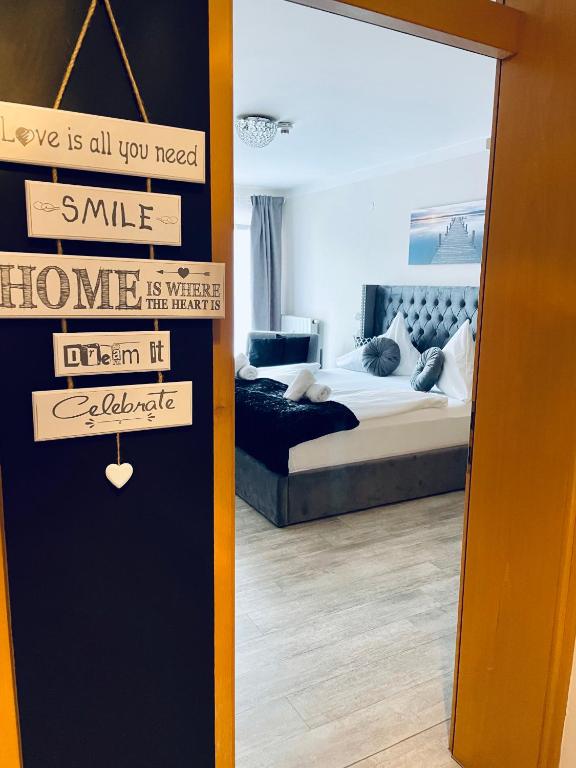 Posteľ alebo postele v izbe v ubytovaní HappyLivingApartments