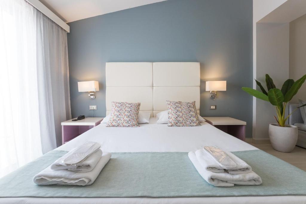 Postel nebo postele na pokoji v ubytování Sunrise Village Hotel - All Inclusive