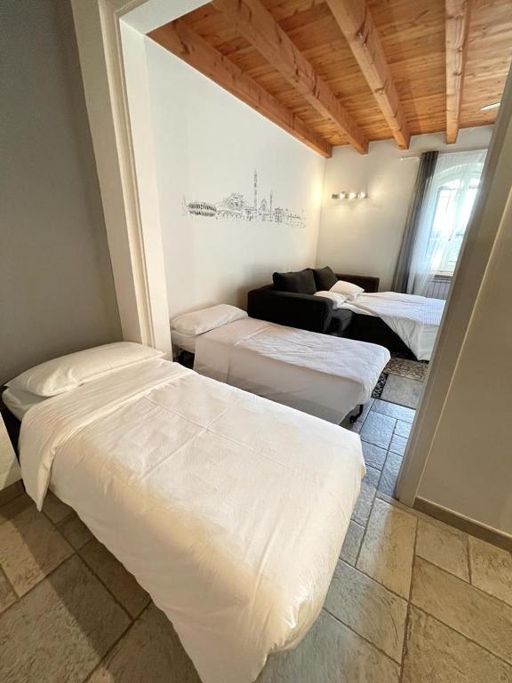 Posteľ alebo postele v izbe v ubytovaní Appartamento San Martino