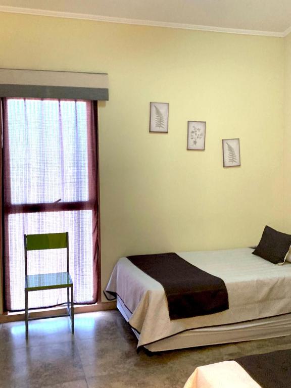 Postel nebo postele na pokoji v ubytování Juku Hostal
