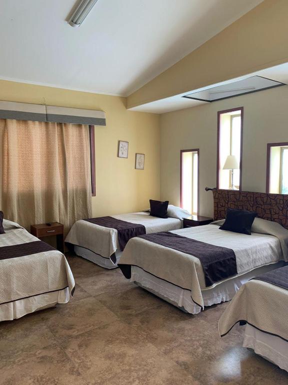 Postel nebo postele na pokoji v ubytování Juku Hostal