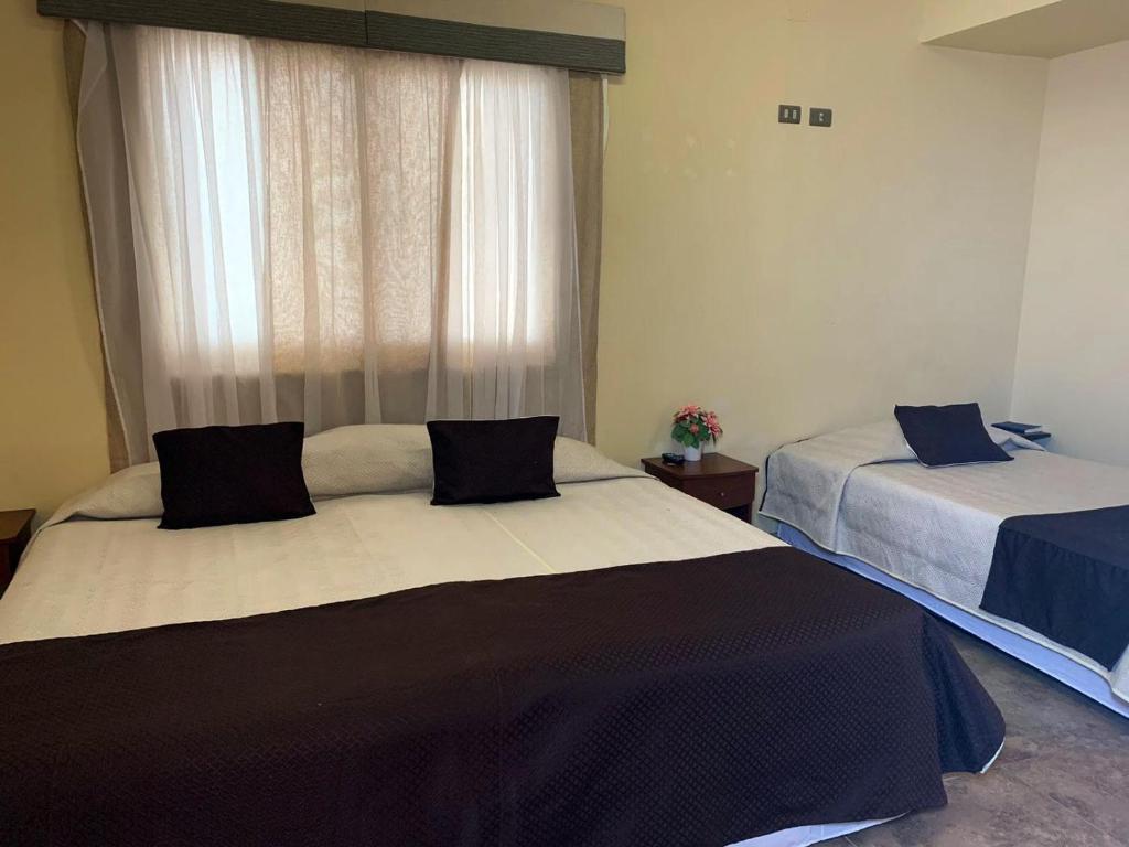 Postel nebo postele na pokoji v ubytování Juku Hostal
