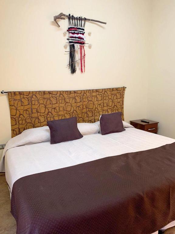 Postel nebo postele na pokoji v ubytování Juku Hostal
