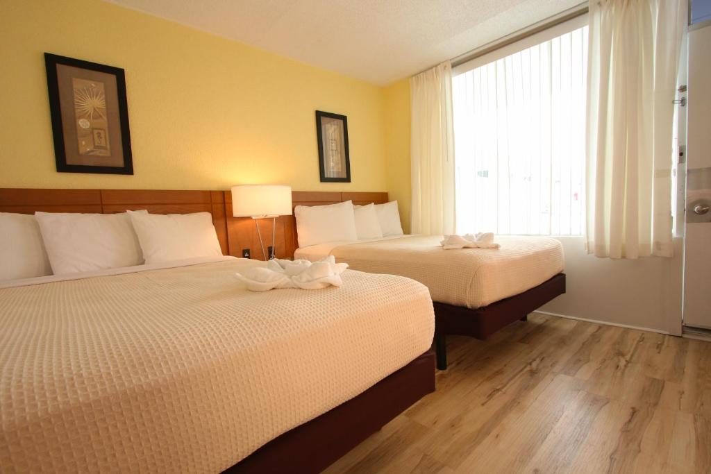 Postel nebo postele na pokoji v ubytování Crusader Oceanfront Resort
