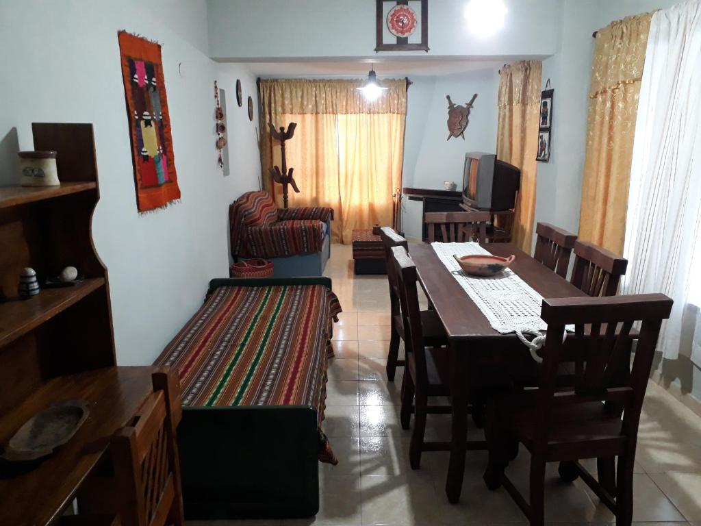 a dining room with a table and chairs at Cabañas La Escondida Casa De Campo 2 in San Antonio de Arredondo
