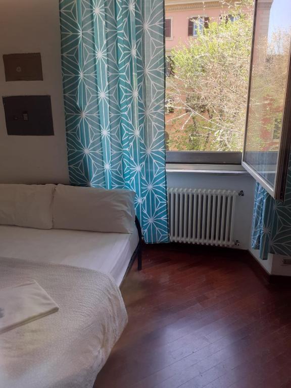 Postel nebo postele na pokoji v ubytování Happy Rome