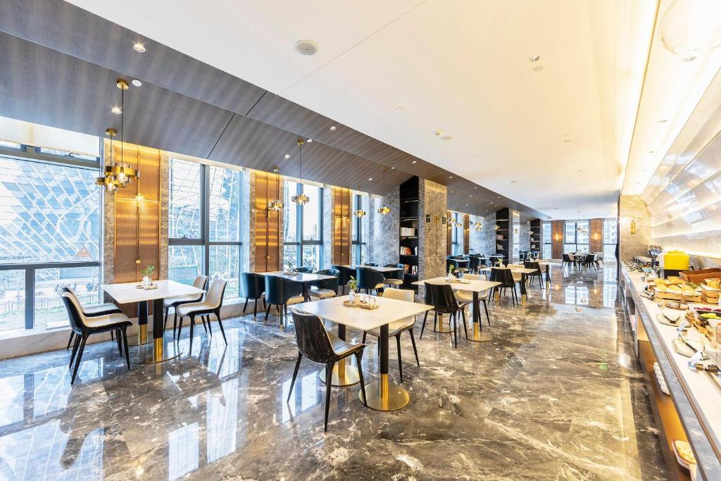 Restoranas ar kita vieta pavalgyti apgyvendinimo įstaigoje Atour Hotel Zhengzhou East Station Longzi Lake