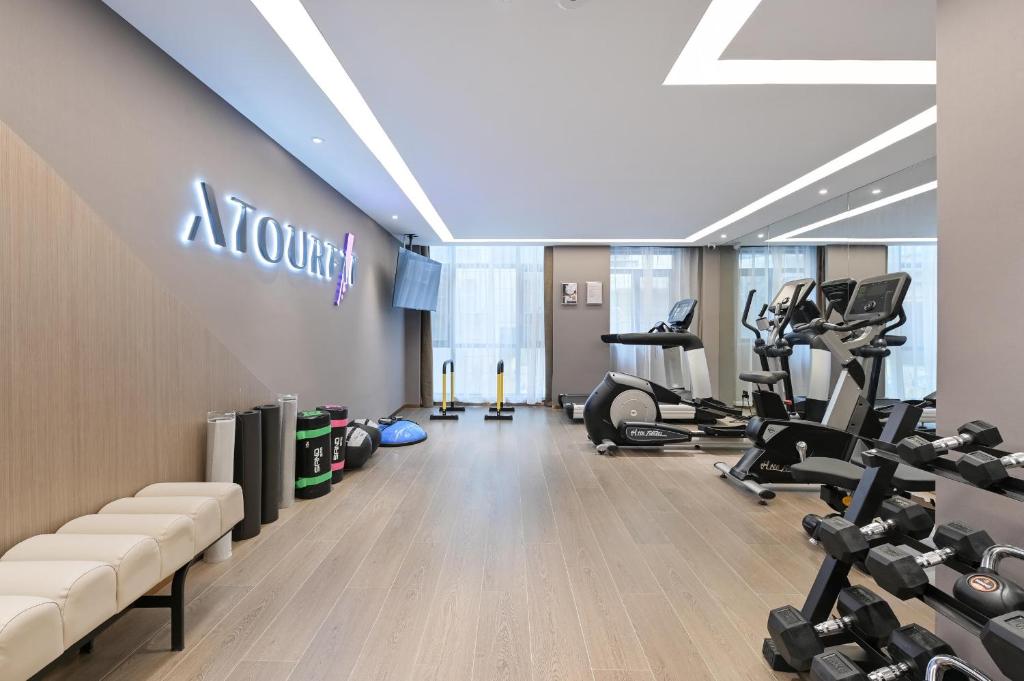 a gym with treadmills and exercise equipment in a building at Atour Hotel Ezhou City Government in Ezhou
