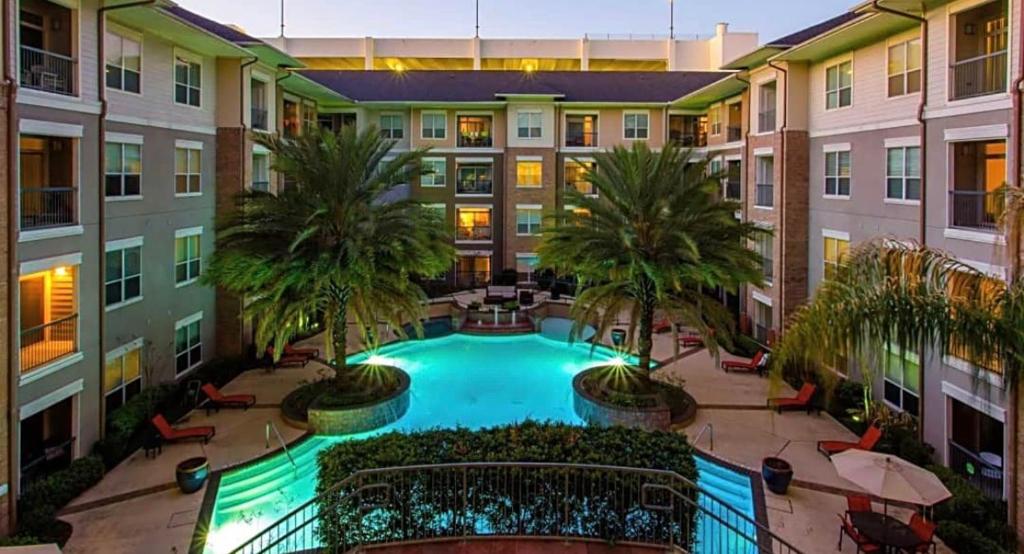 an overhead view of an apartment building with a swimming pool at 2bedroom 1Bath 10 mins to Texas Medical in Houston