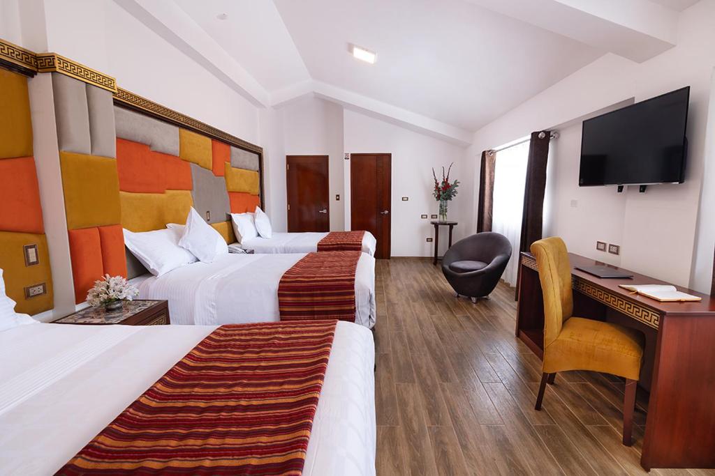 Postel nebo postele na pokoji v ubytování Hotel Hacienda Cusco Centro Historico