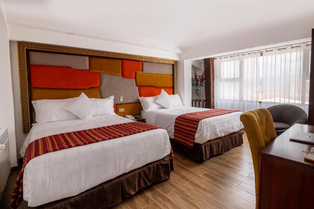 Postel nebo postele na pokoji v ubytování Hotel Hacienda Cusco Centro Historico