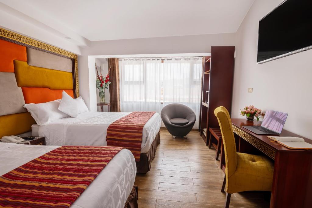 Postel nebo postele na pokoji v ubytování Hotel Hacienda Cusco Centro Historico