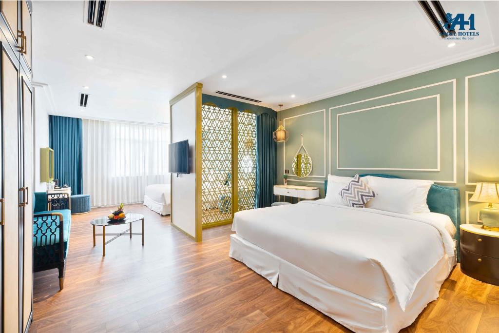 Postel nebo postele na pokoji v ubytování Angel Hotels Beach Danang