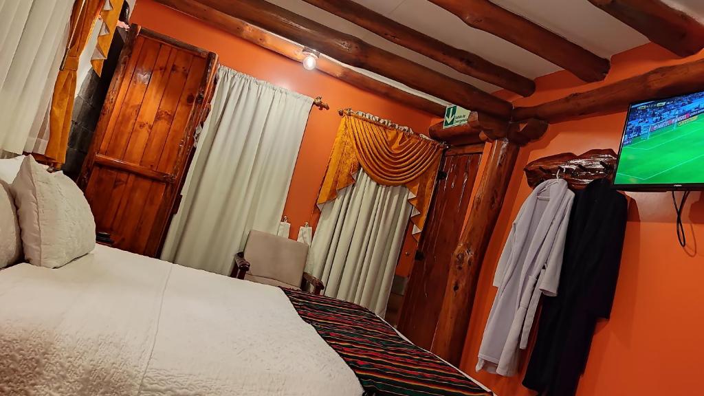 TV a/nebo společenská místnost v ubytování Hotel Maderanegra By Huasicama