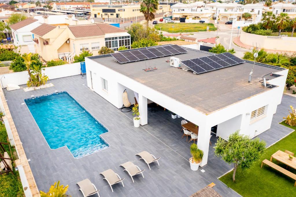 an aerial view of a house with solar panels on the roof at Villa Mi Sol in Torrevieja