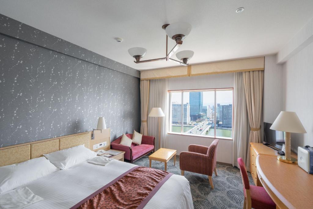 Postel nebo postele na pokoji v ubytování Hotel Okura Niigata