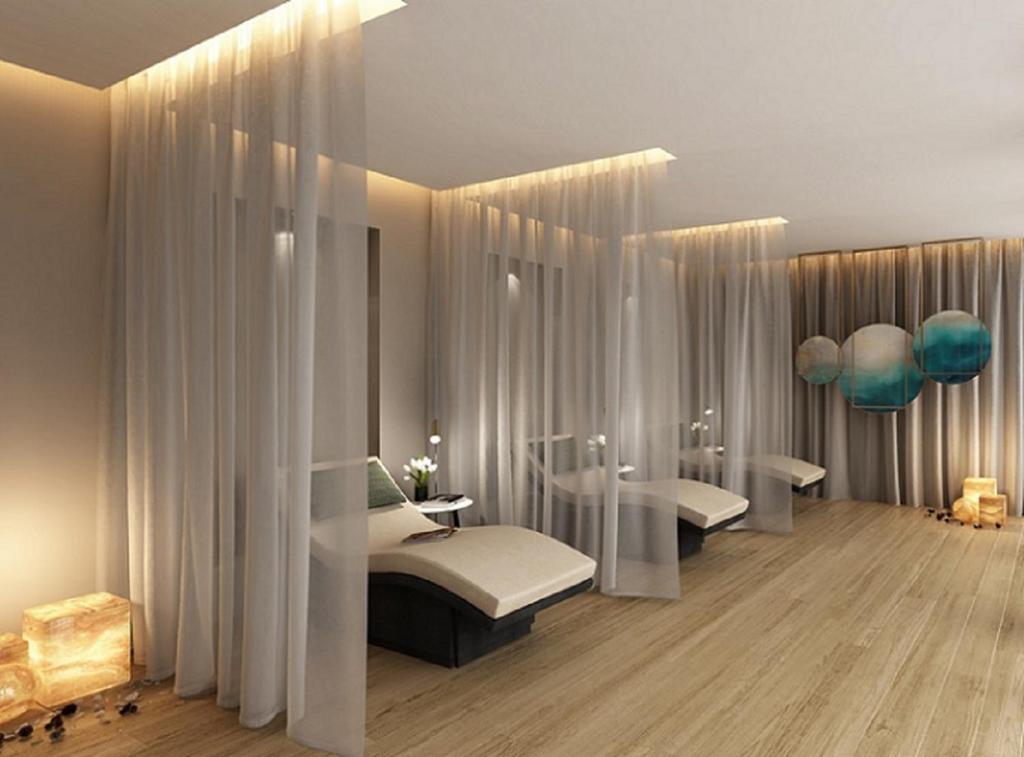 a room with two beds and two sinks in it at Paramount Hotel Midtown in Dubai