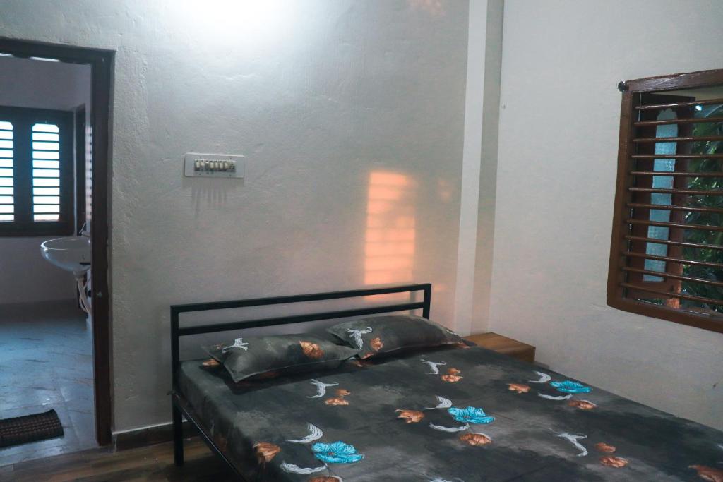 Postel nebo postele na pokoji v ubytování Satvik Stays