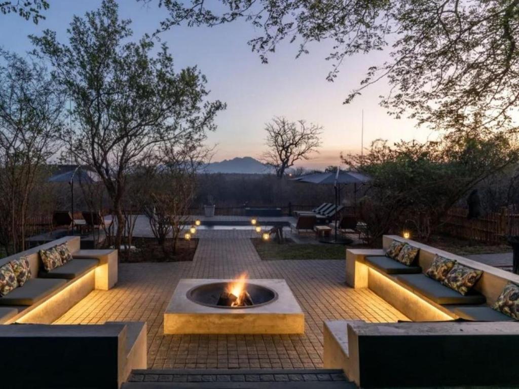 a fire pit in the middle of a patio at Muunga Bush Lodge & Spa in Hoedspruit