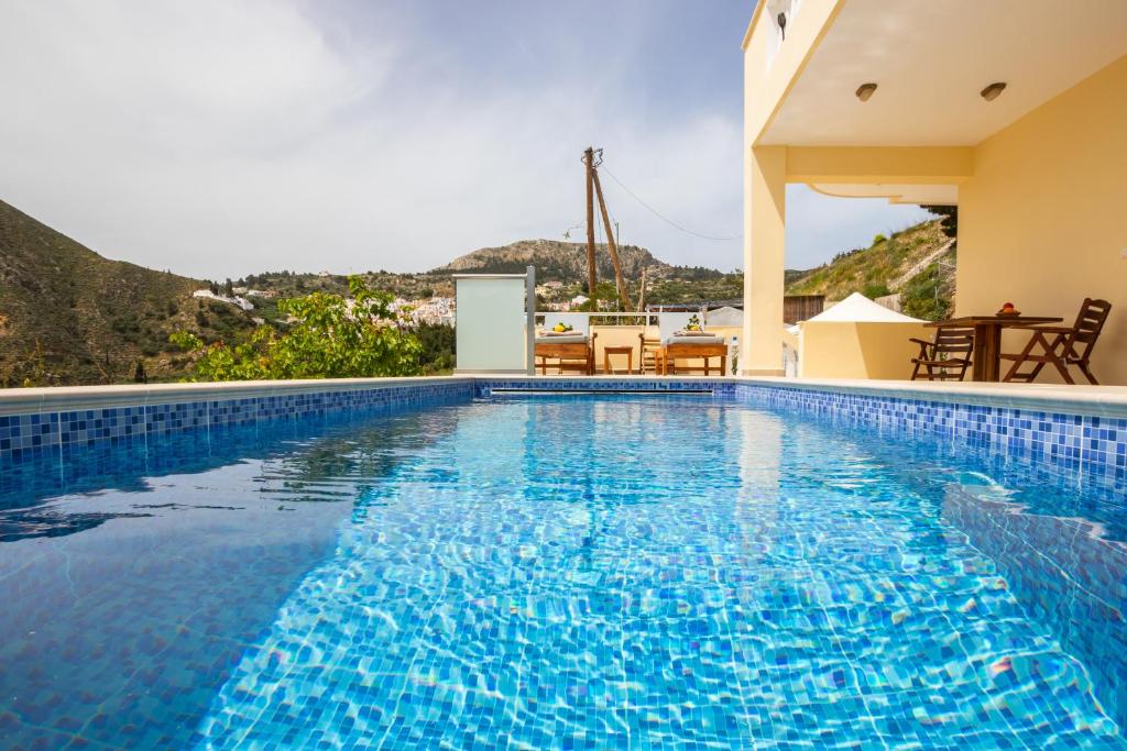 a swimming pool in a villa with a view at Karpathos View Villa in Karpathos