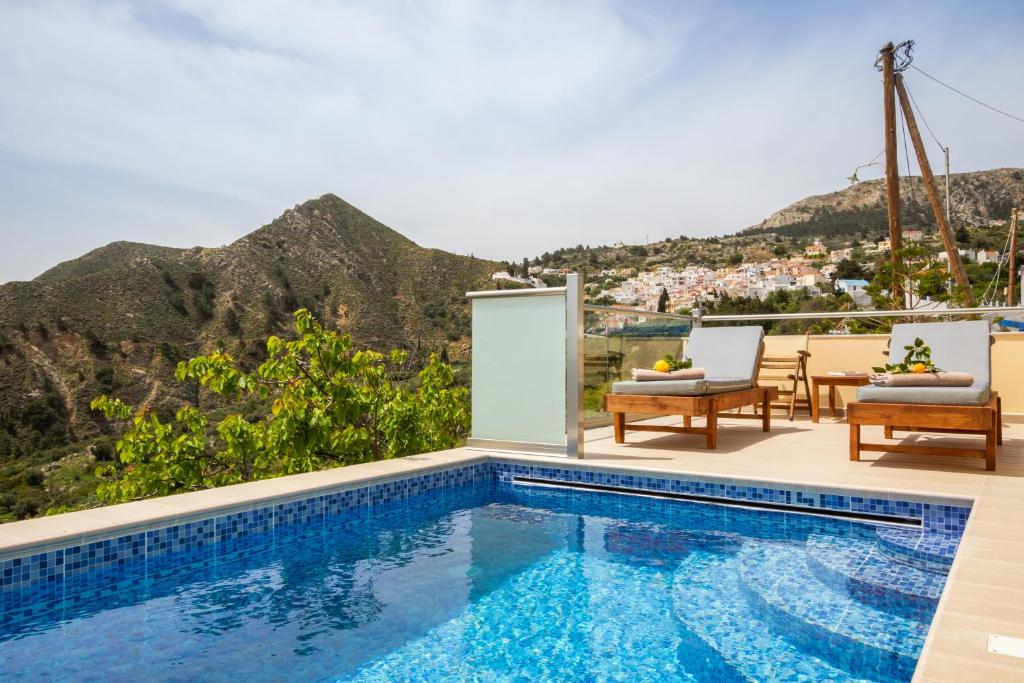 a swimming pool with a view of a mountain at Karpathos View Villa in Karpathos