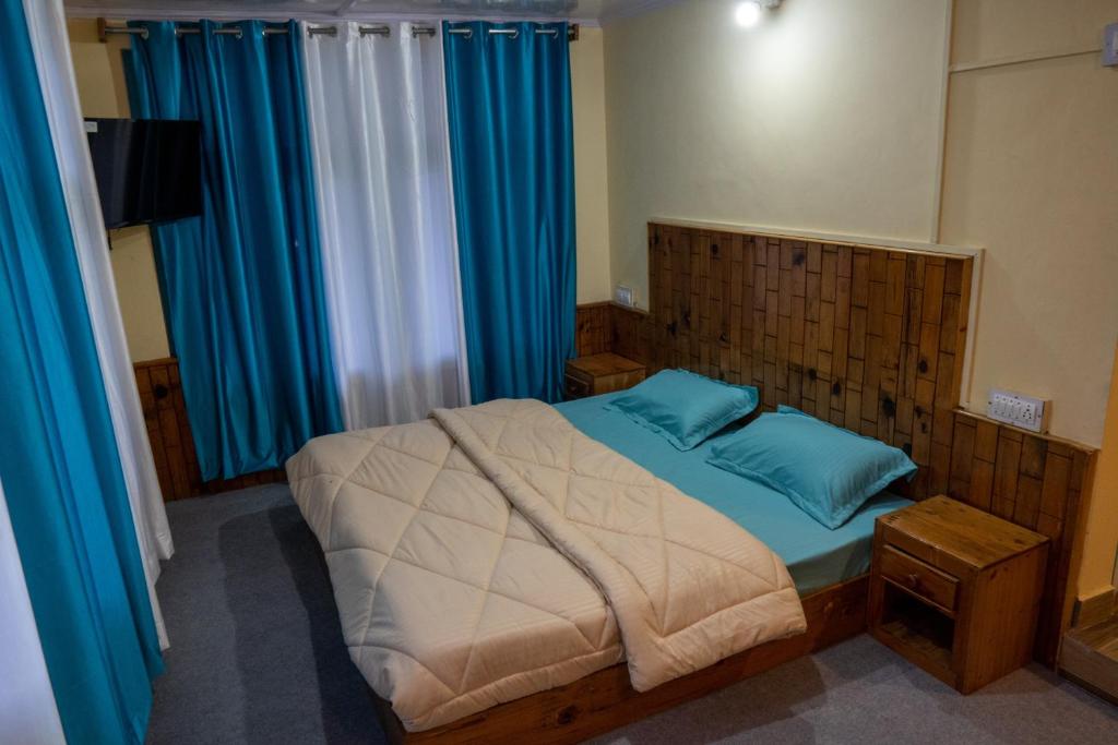 Postel nebo postele na pokoji v ubytování The Vagabond Manali