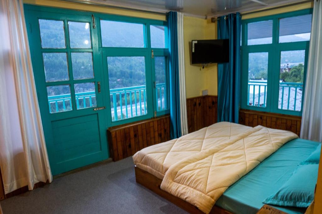 Postel nebo postele na pokoji v ubytování The Vagabond Manali