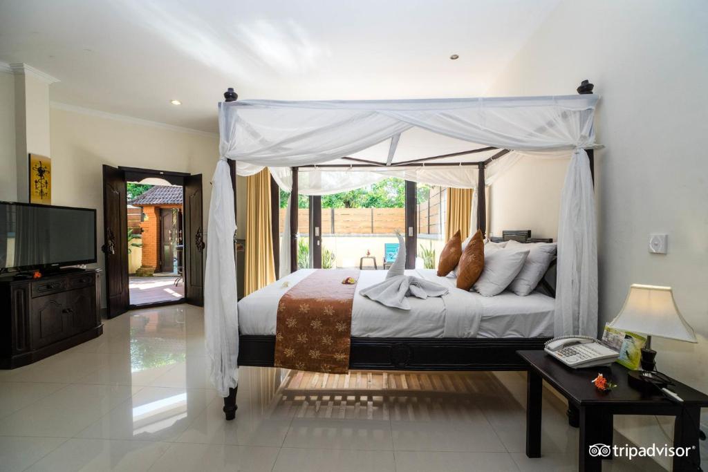 Postel nebo postele na pokoji v ubytování Bali Ayu Hotel & Villas