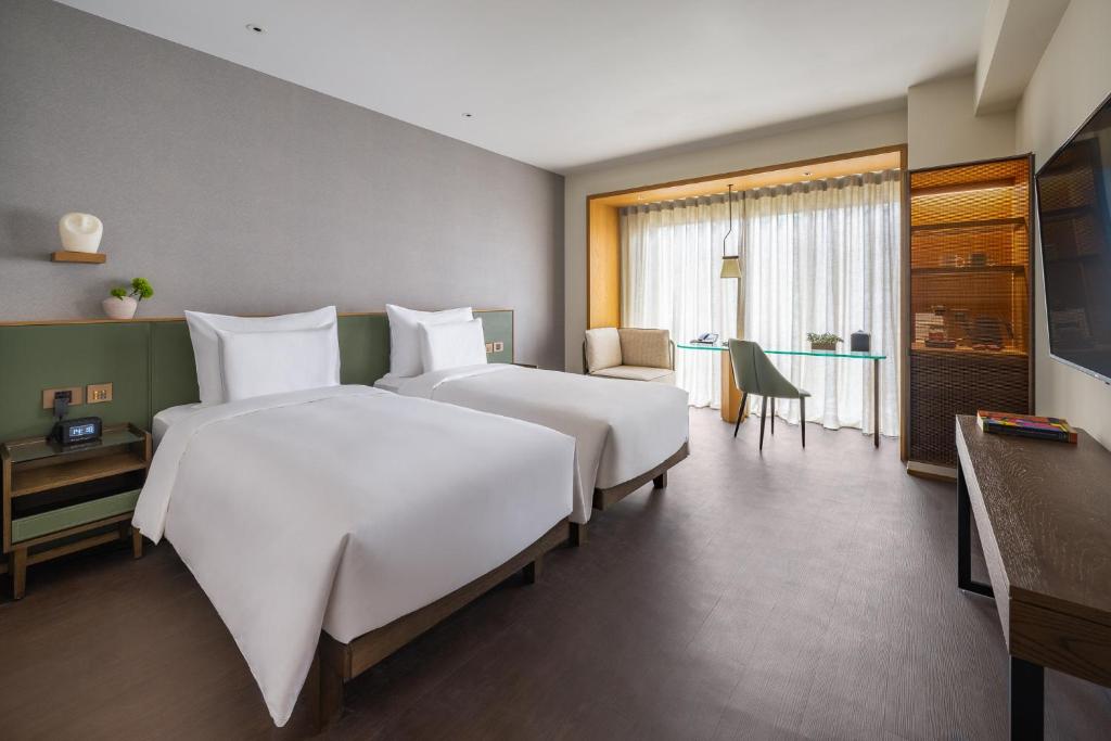 Postel nebo postele na pokoji v ubytování Humble Boutique Hotel