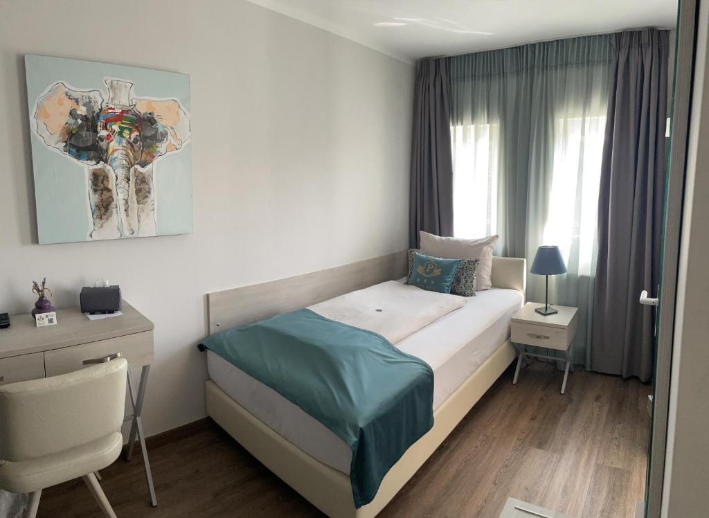 Katil atau katil-katil dalam bilik di Hotel Post Sindelfingen