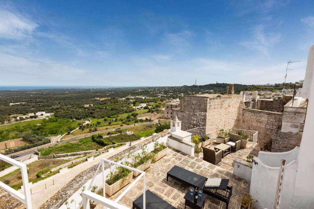a view of the city from the balcony of a building at Casa degli Amici by BarbarHouse in Ostuni