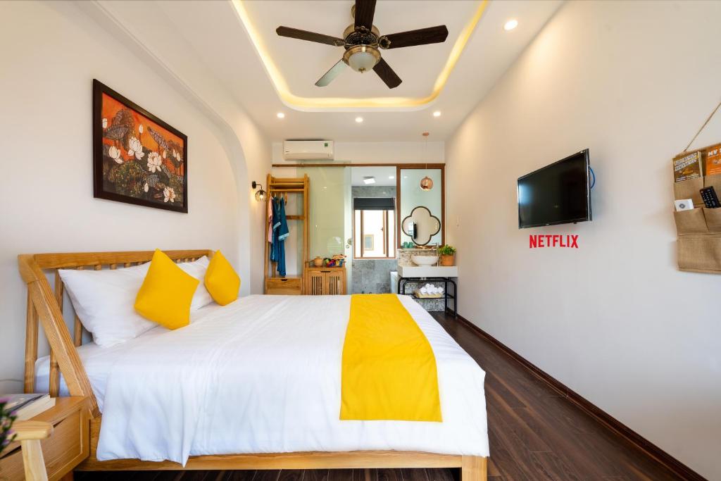 Postel nebo postele na pokoji v ubytování An Nhien Boutique Villa