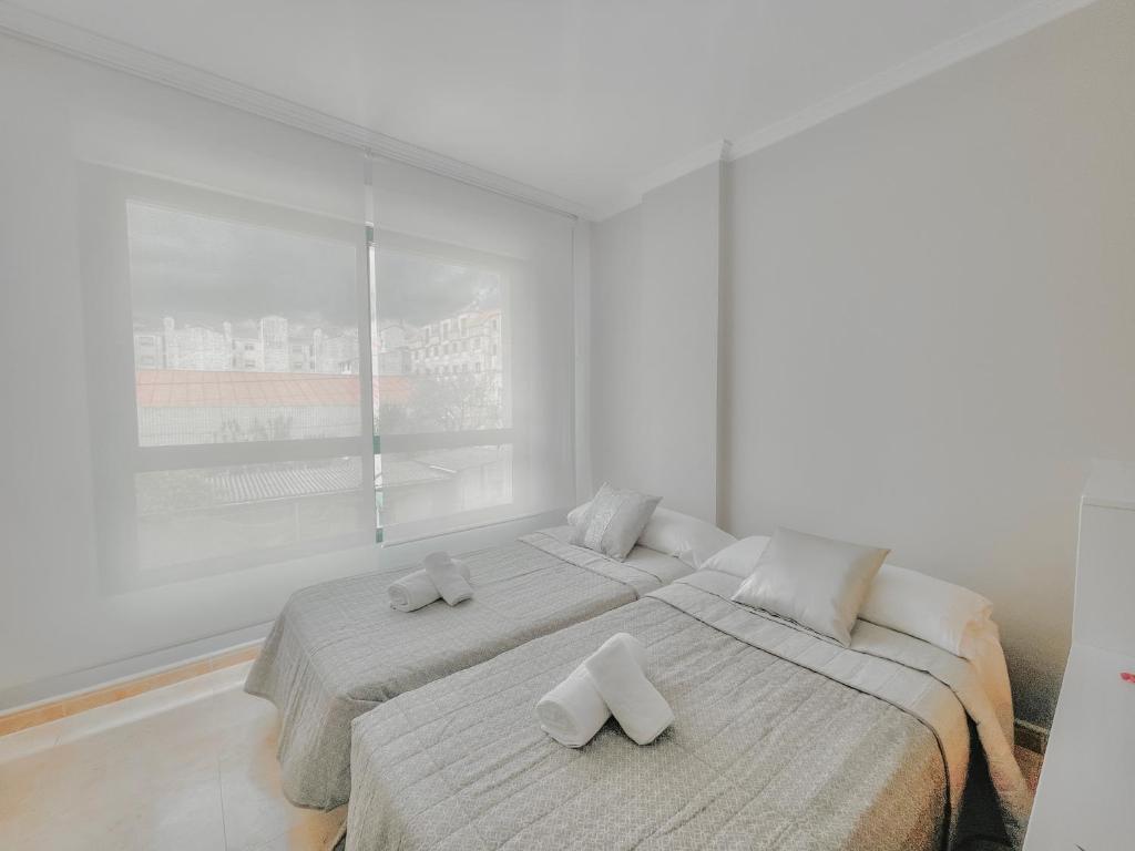 A bed or beds in a room at Sarnadela