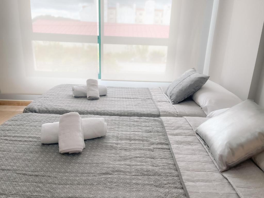 A bed or beds in a room at Sarnadela