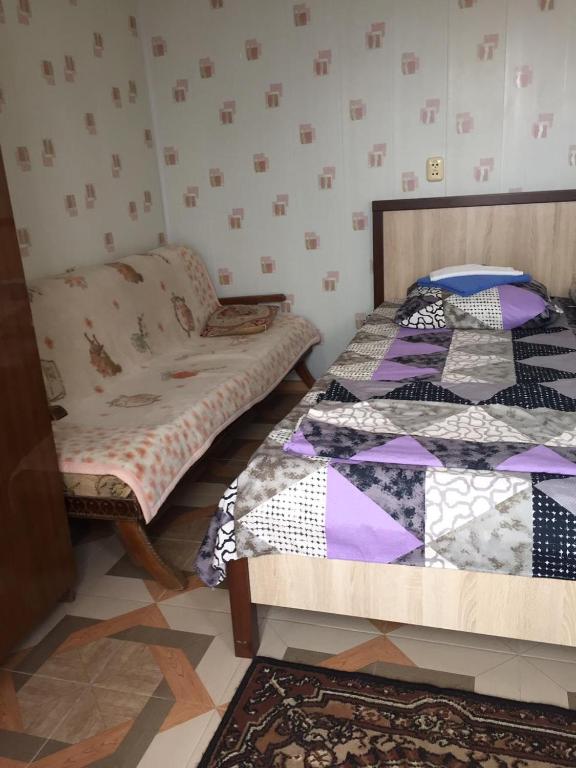 Postel nebo postele na pokoji v ubytování Гостевой дом Кристина