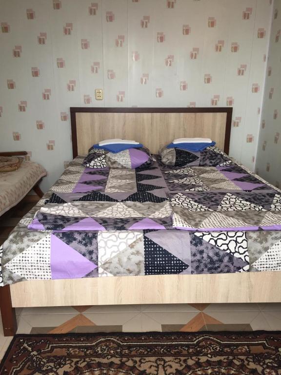 Postel nebo postele na pokoji v ubytování Гостевой дом Кристина