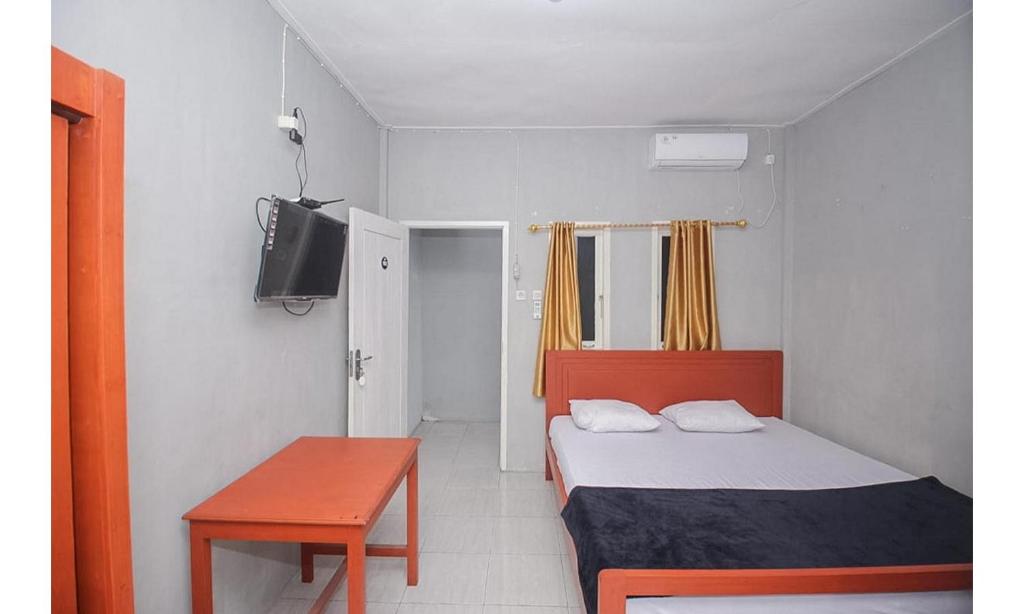 Katil atau katil-katil dalam bilik di Lidez Residence Bitung