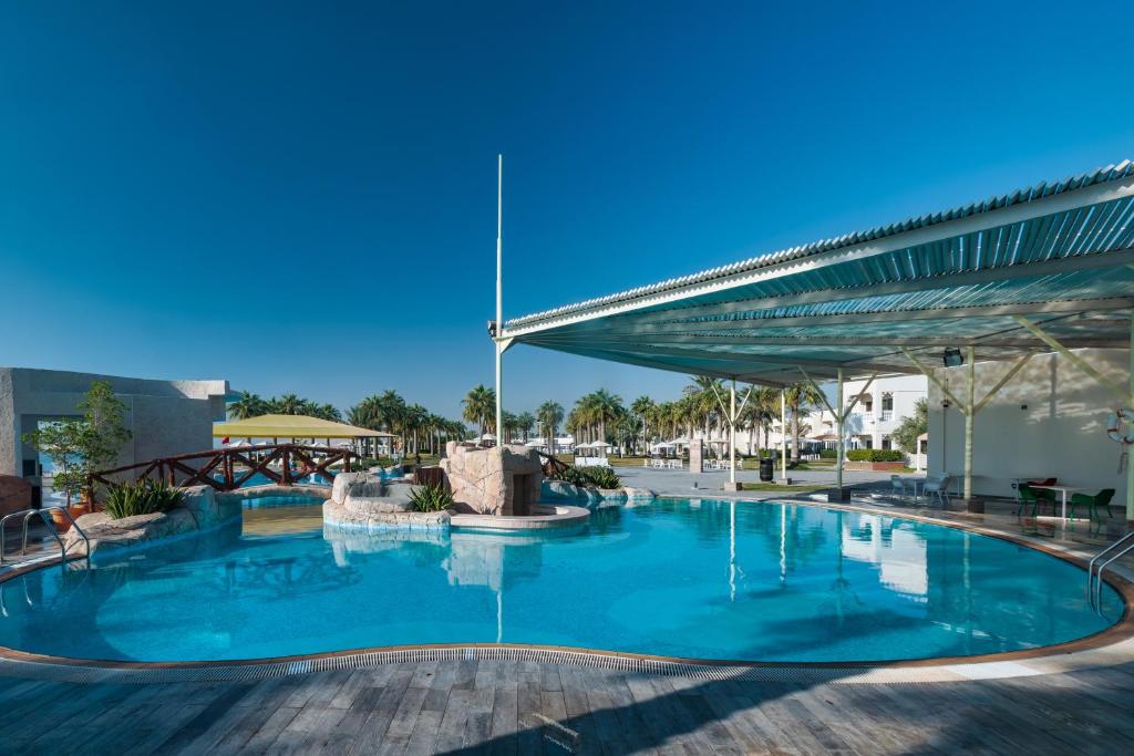 Bazén v ubytování Sealine Beach, a Murwab Resort nebo v jeho okolí